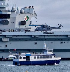 HMS Queen Elizabeth and Ali Cat. photo courtesy of Solent Cruises